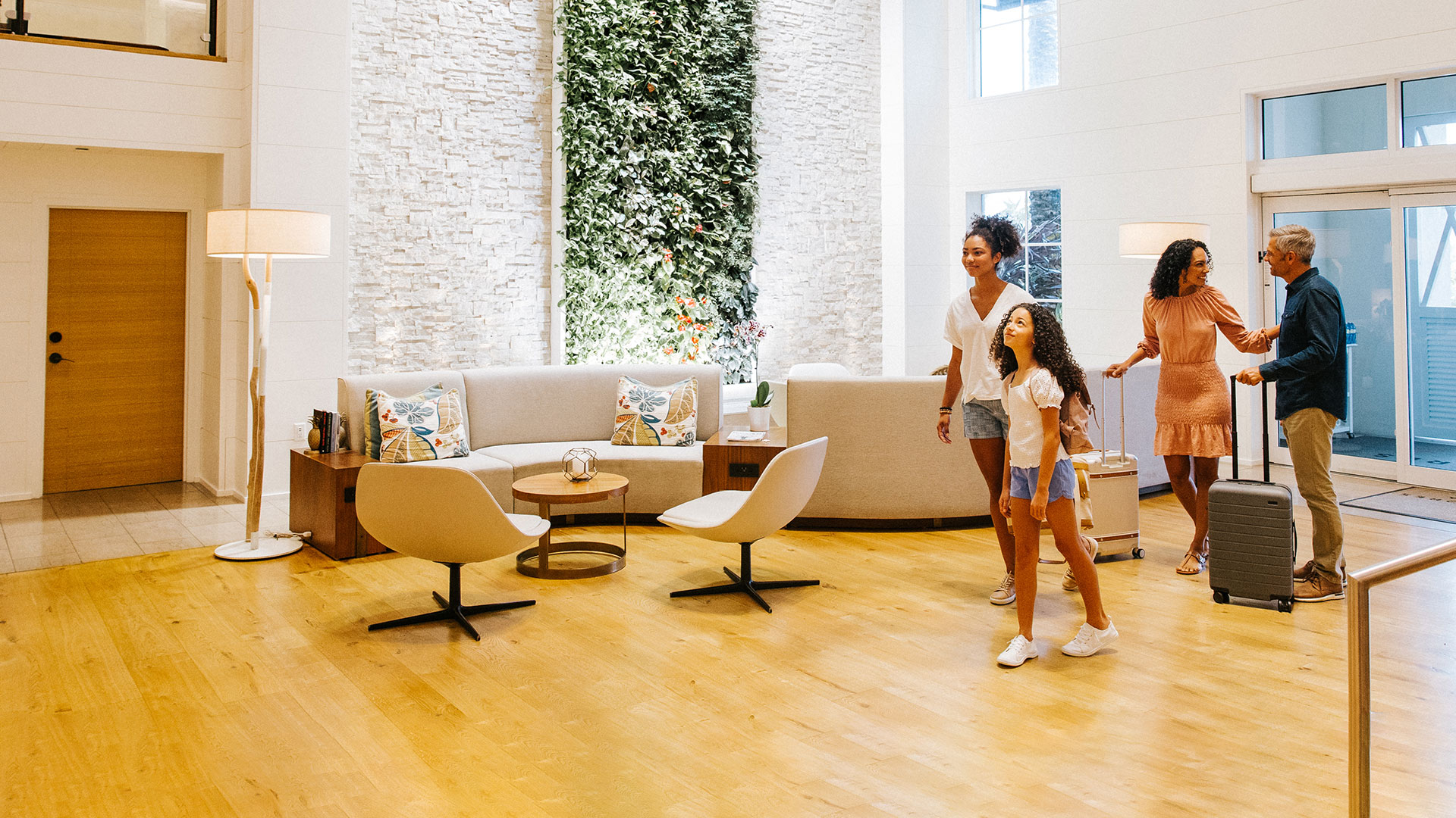 A family enters the lobby at Hutchinson Island Beach Resort & Spa.