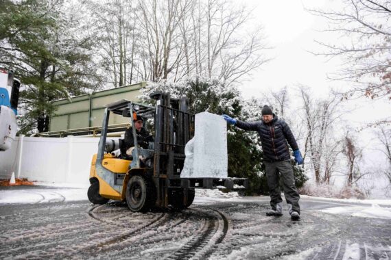 A ice sculptor delivers a piece for the annual Glacier Ice Bar.