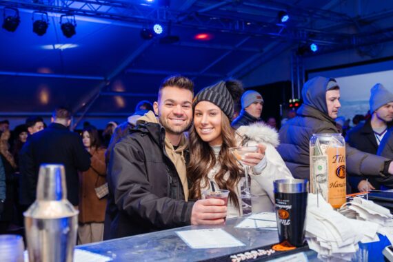 Attendees to the ice bar with drinks.