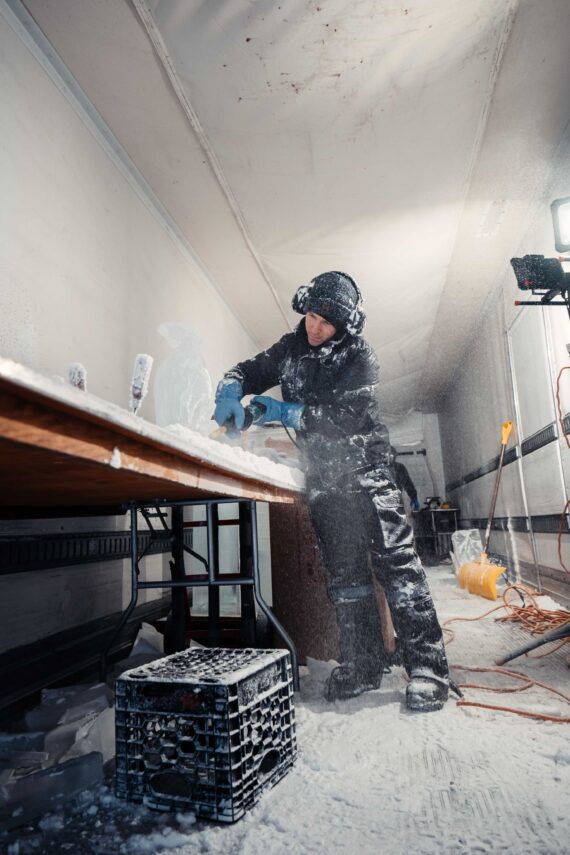 A ice sculptor carves out an piece for the annual Glacier Ice Bar.