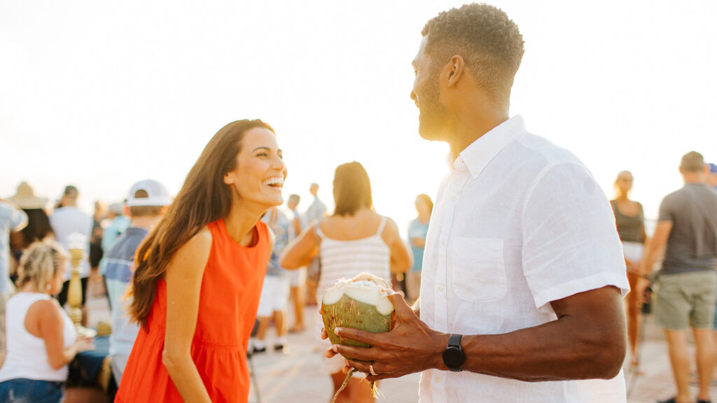 A couple dances at an open-air outdoor festival.