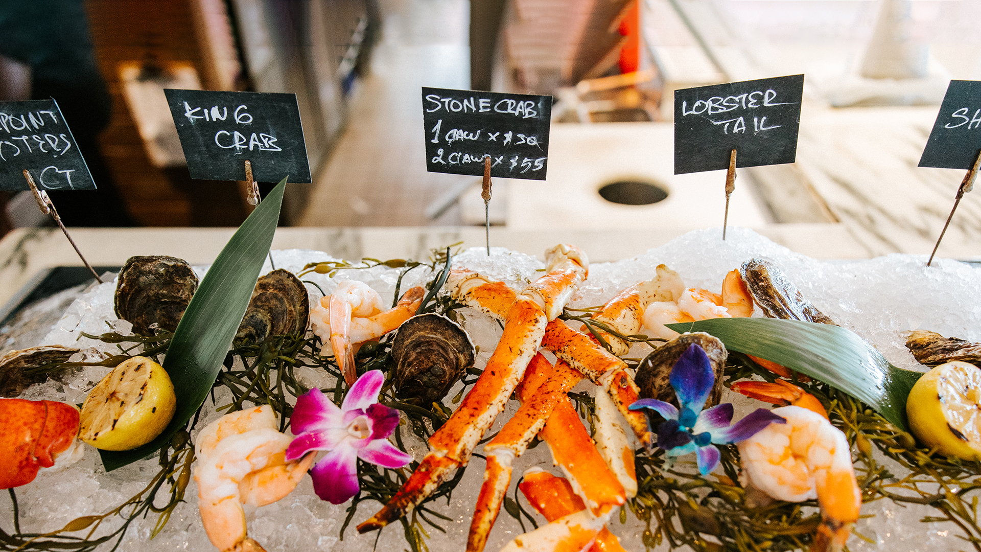 A seafood bar in Delray Beach, Florida features an array of seafood during stone crab season in Florida.