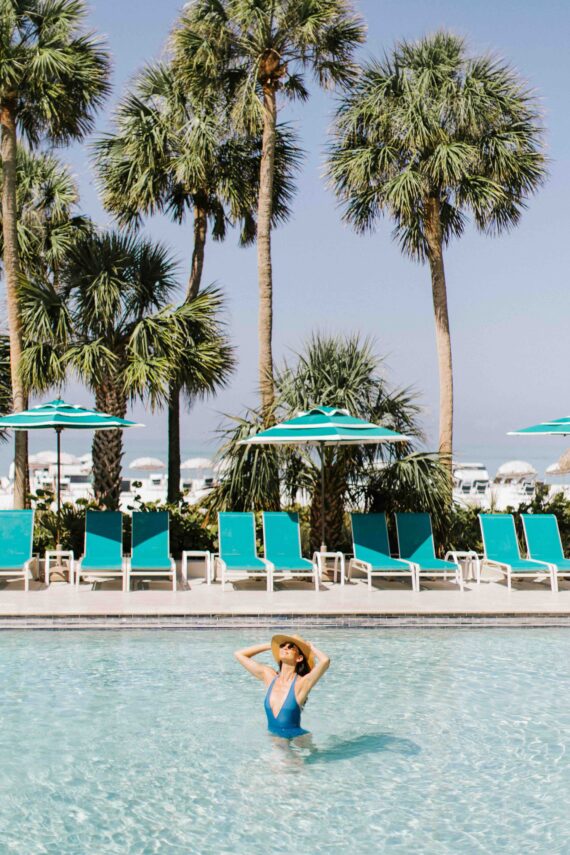 woman swimming in a pool at longboat key club