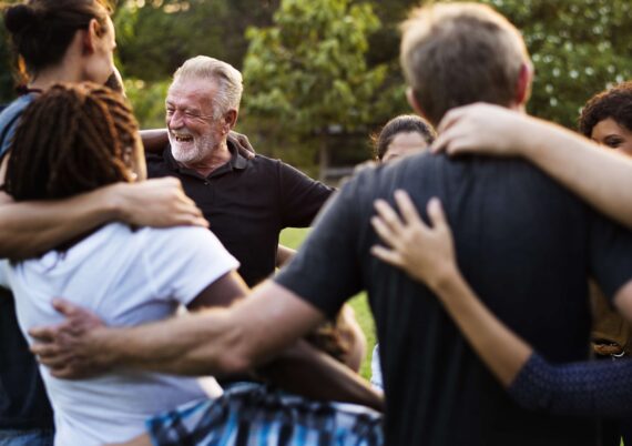 A group celebrates after a team-building session together.