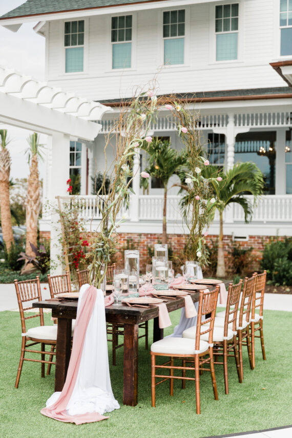 A wedding table set up on the front lawn of the belleview inn