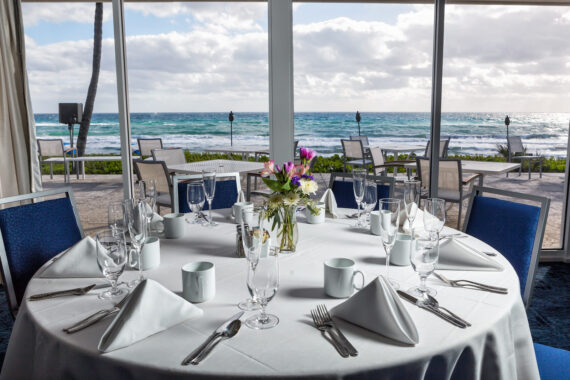 round table set up for an event overlooking the water